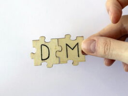 puzzle pieces showing letters d and m