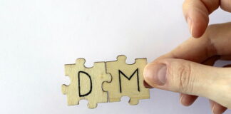 puzzle pieces showing letters d and m
