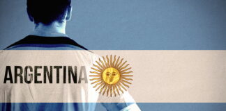 footballer holding ball argentina flag