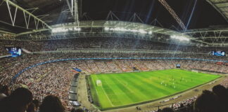 panoramic view inside tottenham stadium packed stands during game