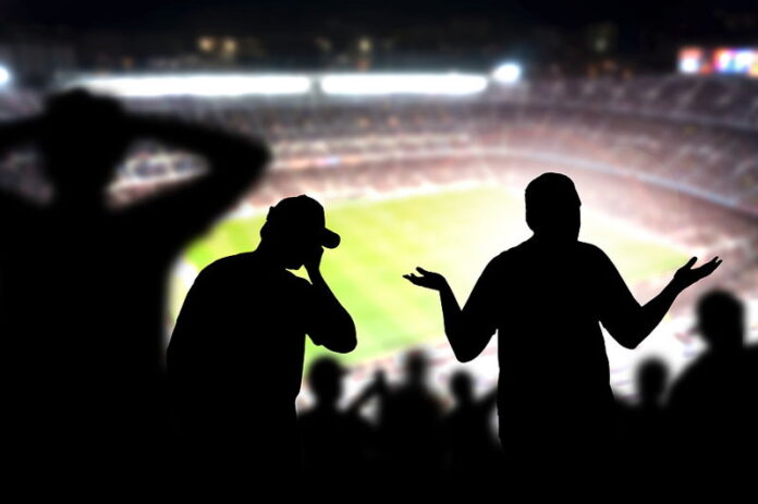 frustrated angry football fans in stadium silhouette people watching