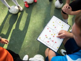 football manger going through tactics with a team