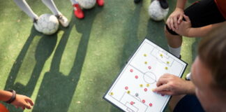 football manger going through tactics with a team
