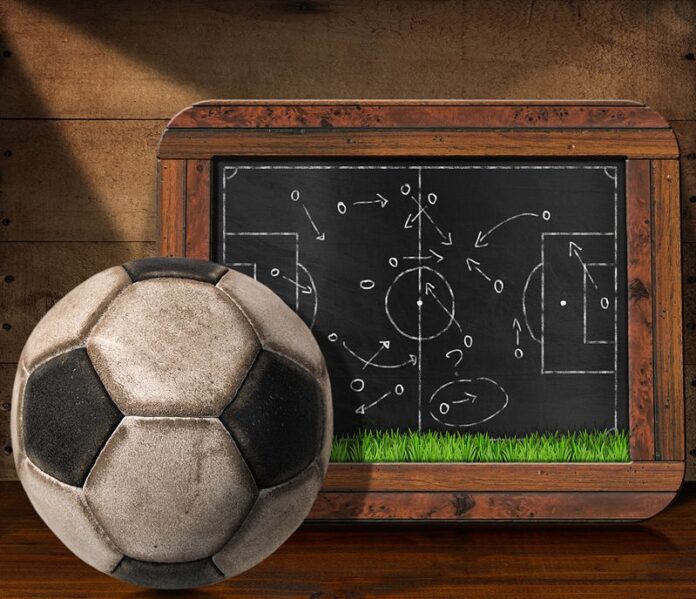 blackboard with football pitch and ball