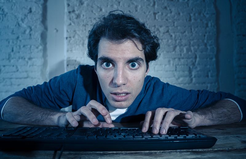 man addicted to computer game