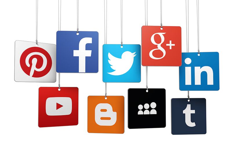 social media logo signs hanging on string