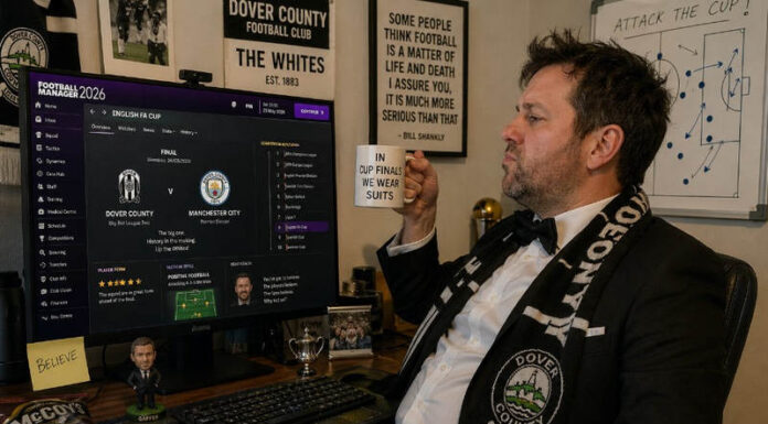Man wearing suit to play football manager